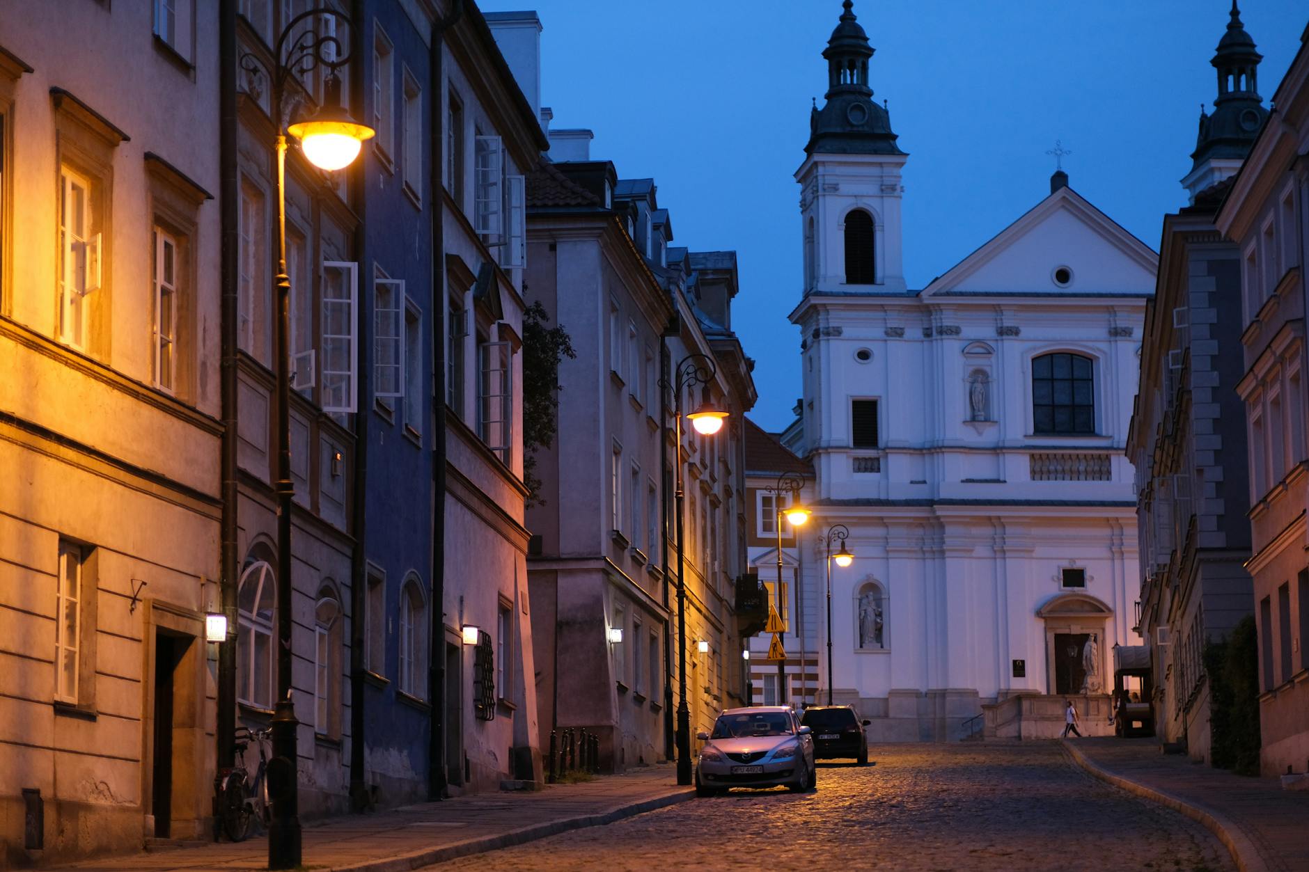 Warsaw evening street scene for solo after-dark planning.