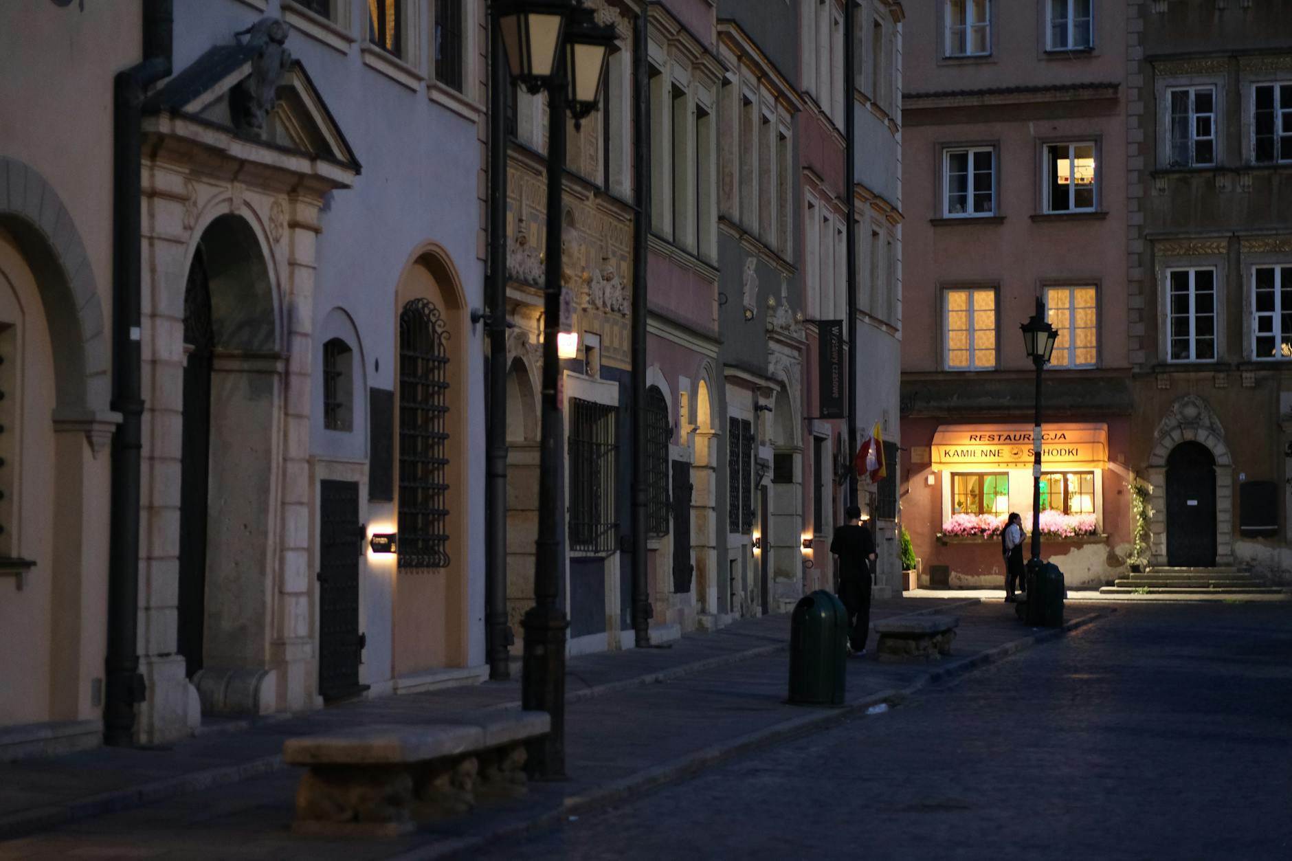 Warsaw evening old town setting for woman traveler planning.