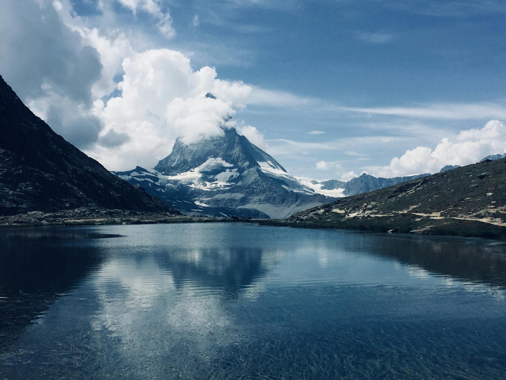 Alpine peaks and clouds for Zermatt budget weather planning.