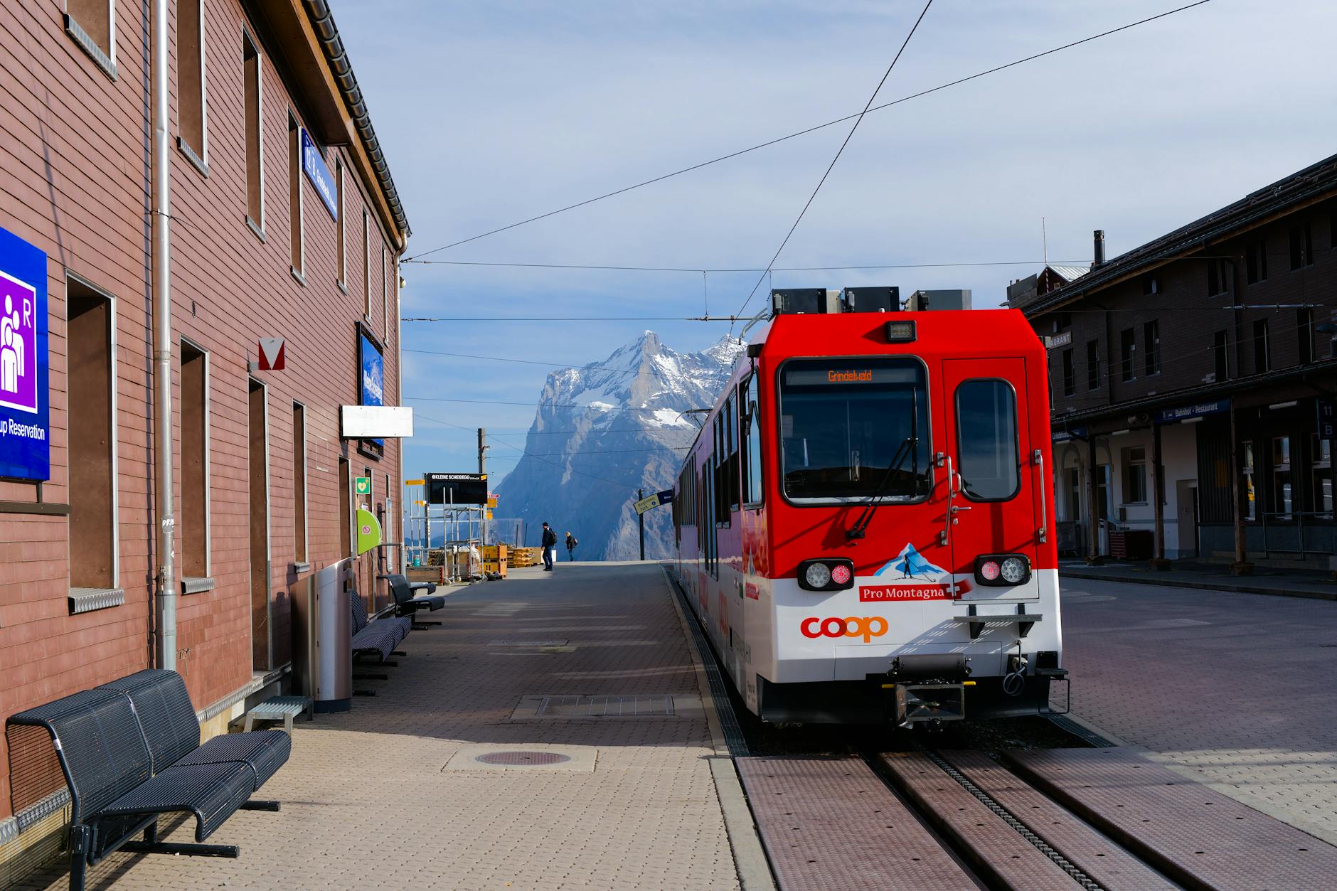 Red mountain train near Zermatt for business arrival planning.