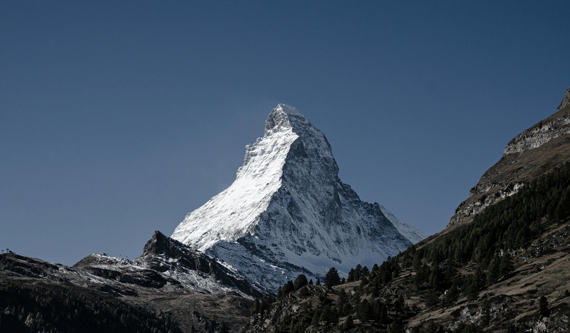 Snow-covered Matterhorn for family Zermatt travel report planning.
