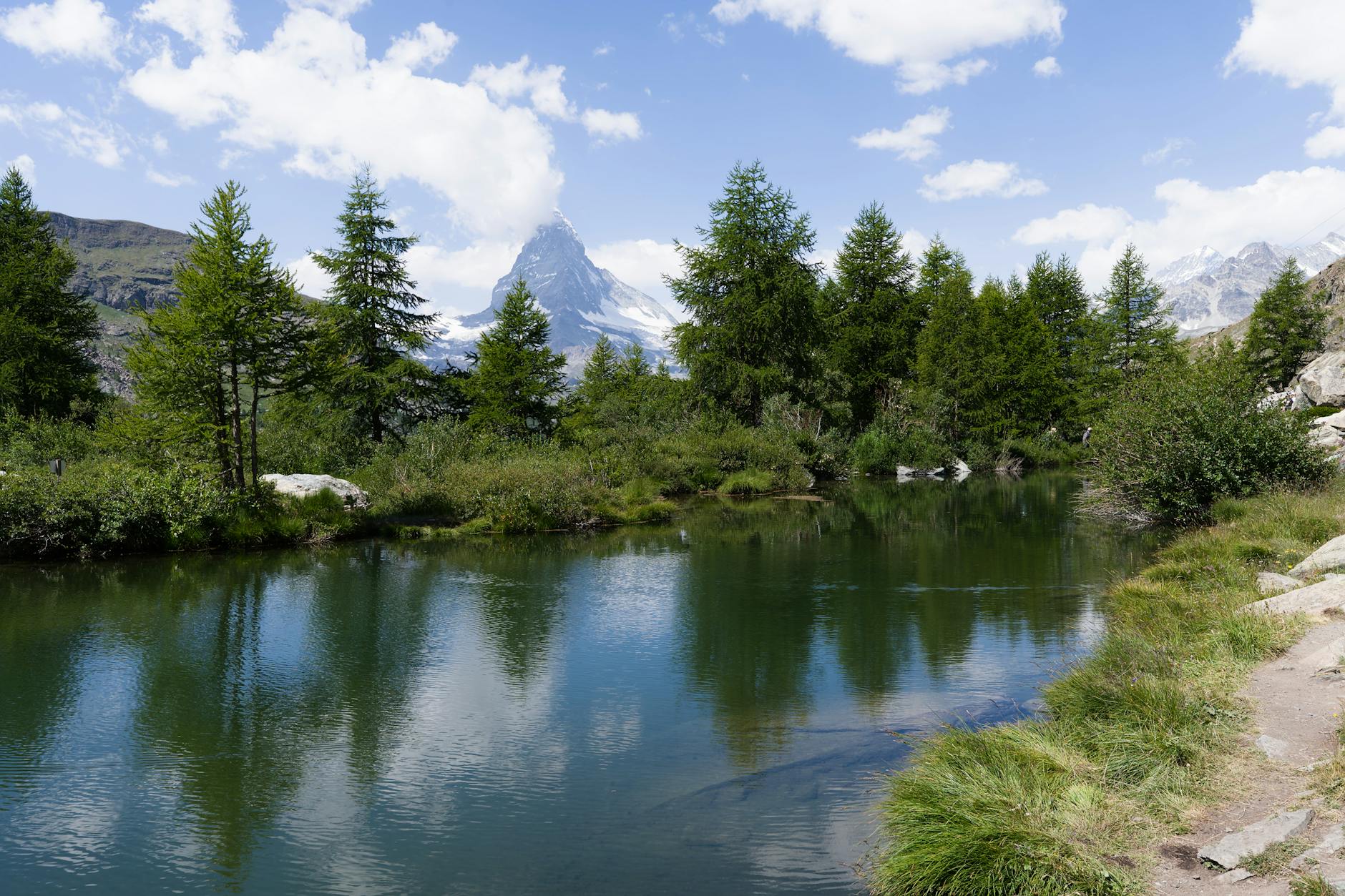 Matterhorn reflected in an alpine lake for first-time Zermatt cost planning.