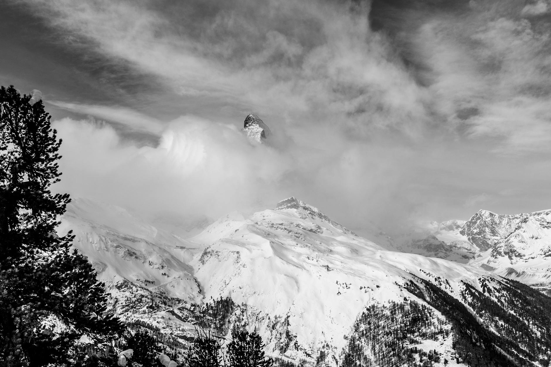 Matterhorn clouds and alpine ridge for Zermatt reporting weather planning.
