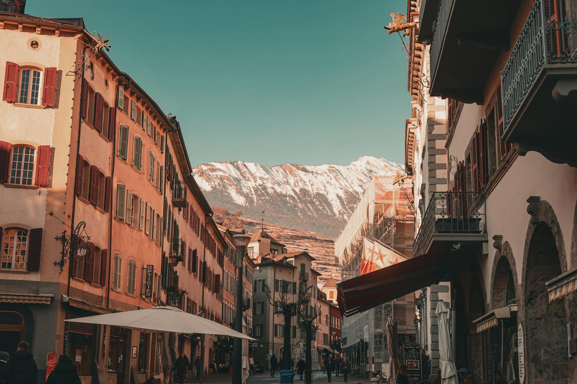 Winter alpine village street for older traveler pacing and departure planning.