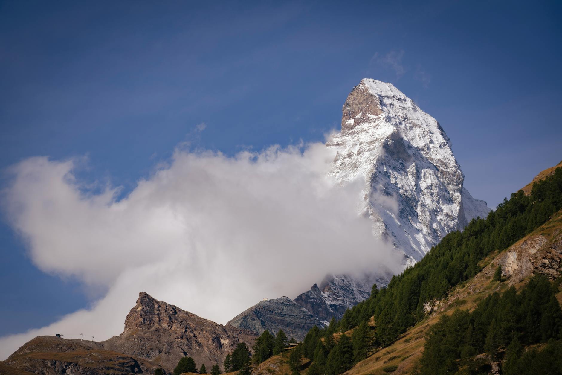 Matterhorn peak and clouds for solo Zermatt budget and weather planning.