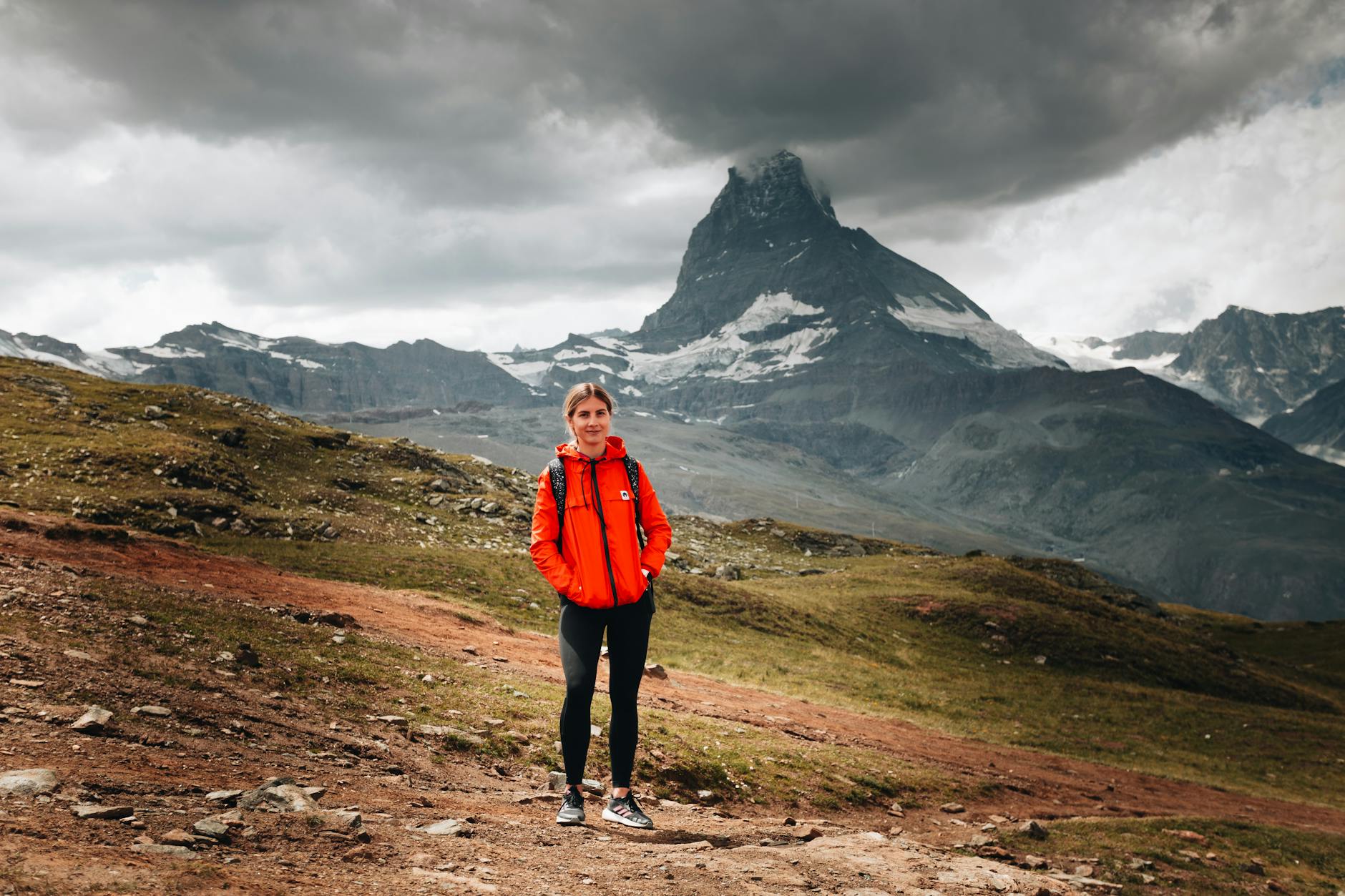 Woman traveler facing the Matterhorn for Zermatt travel planning.