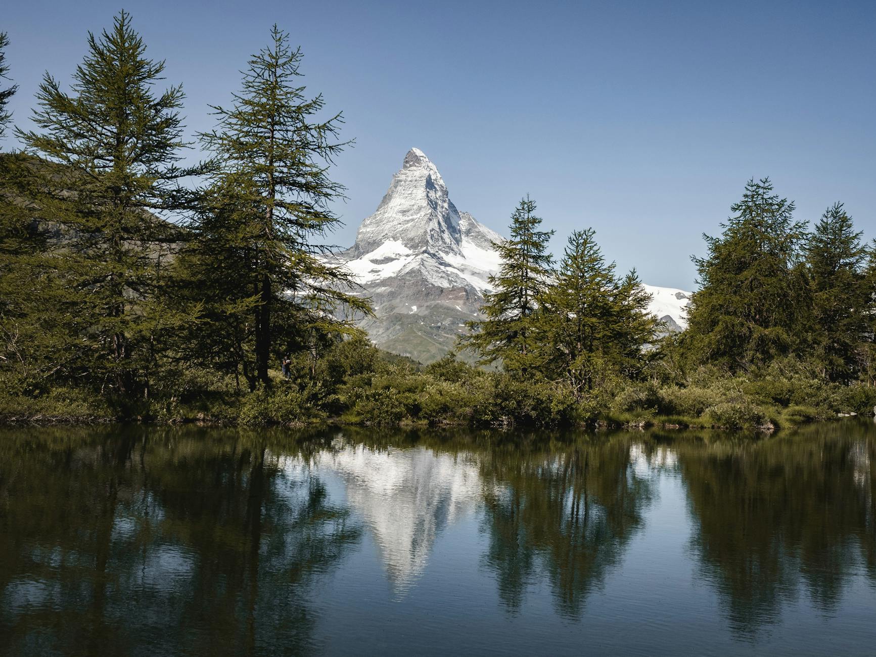 Matterhorn lake reflection for Zermatt communication and backup planning.