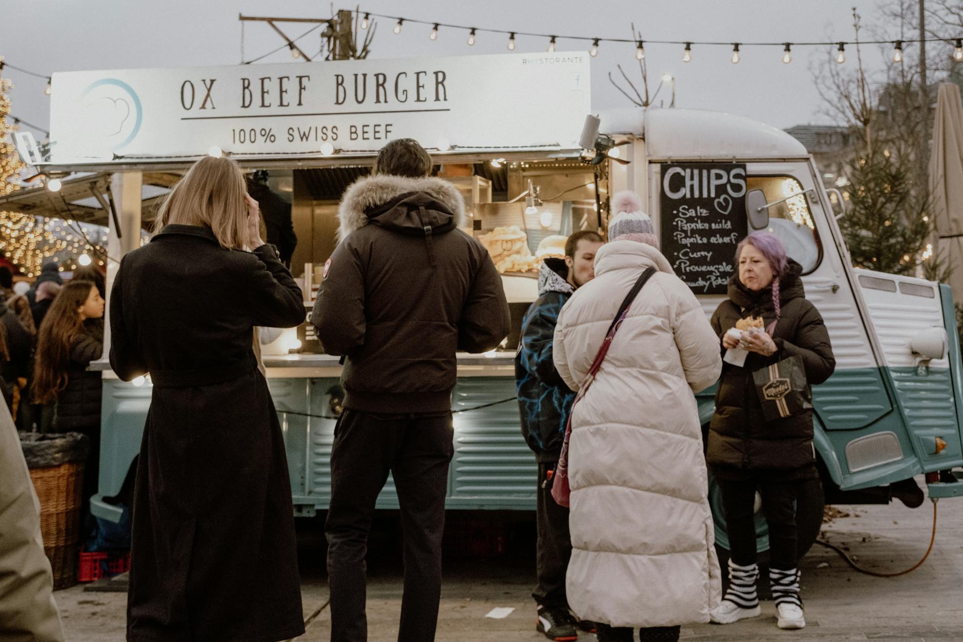 Zurich market food stand context for budget meals and low-cost city time.