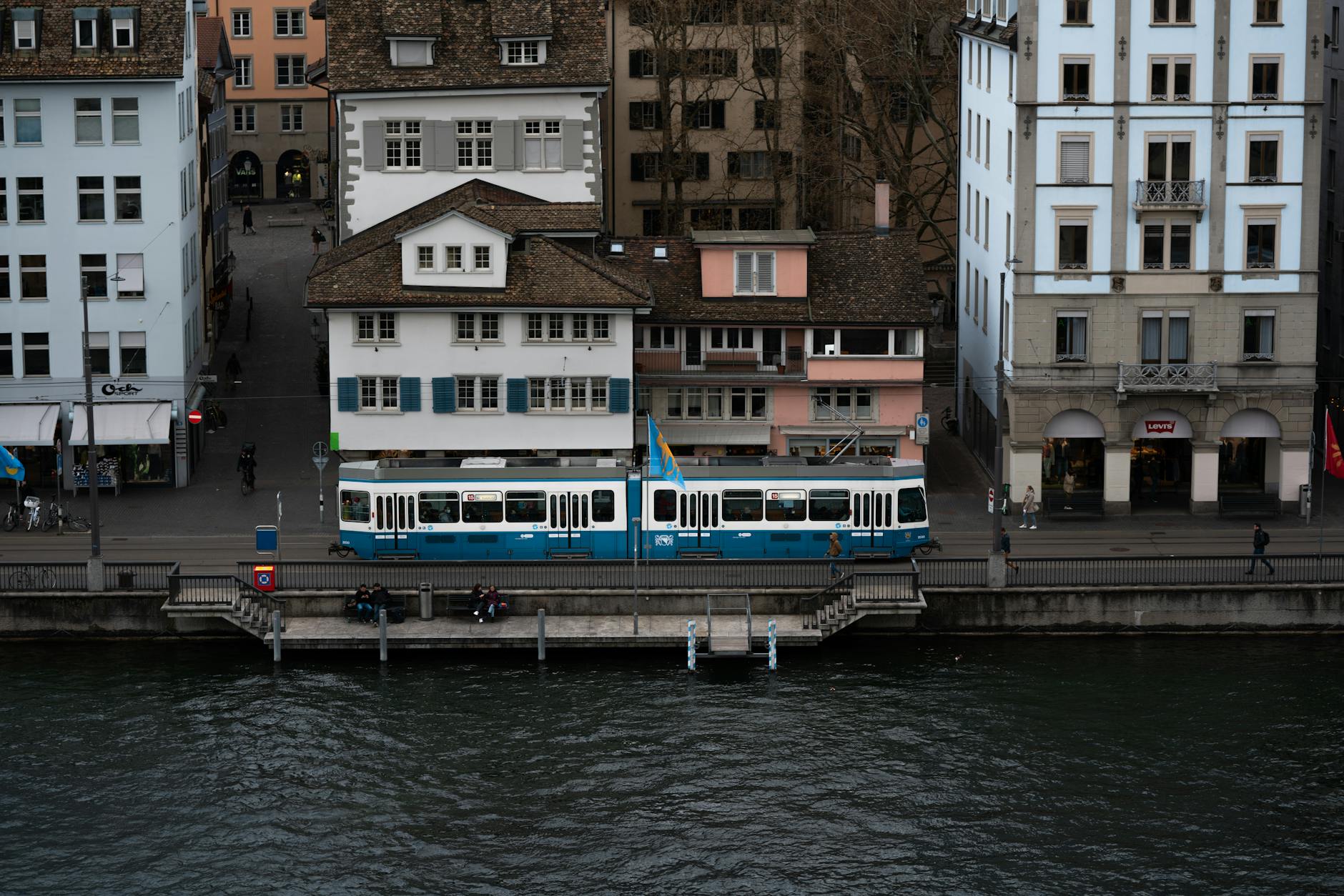 Zurich tram by the river context for choosing an affordable lodging base.