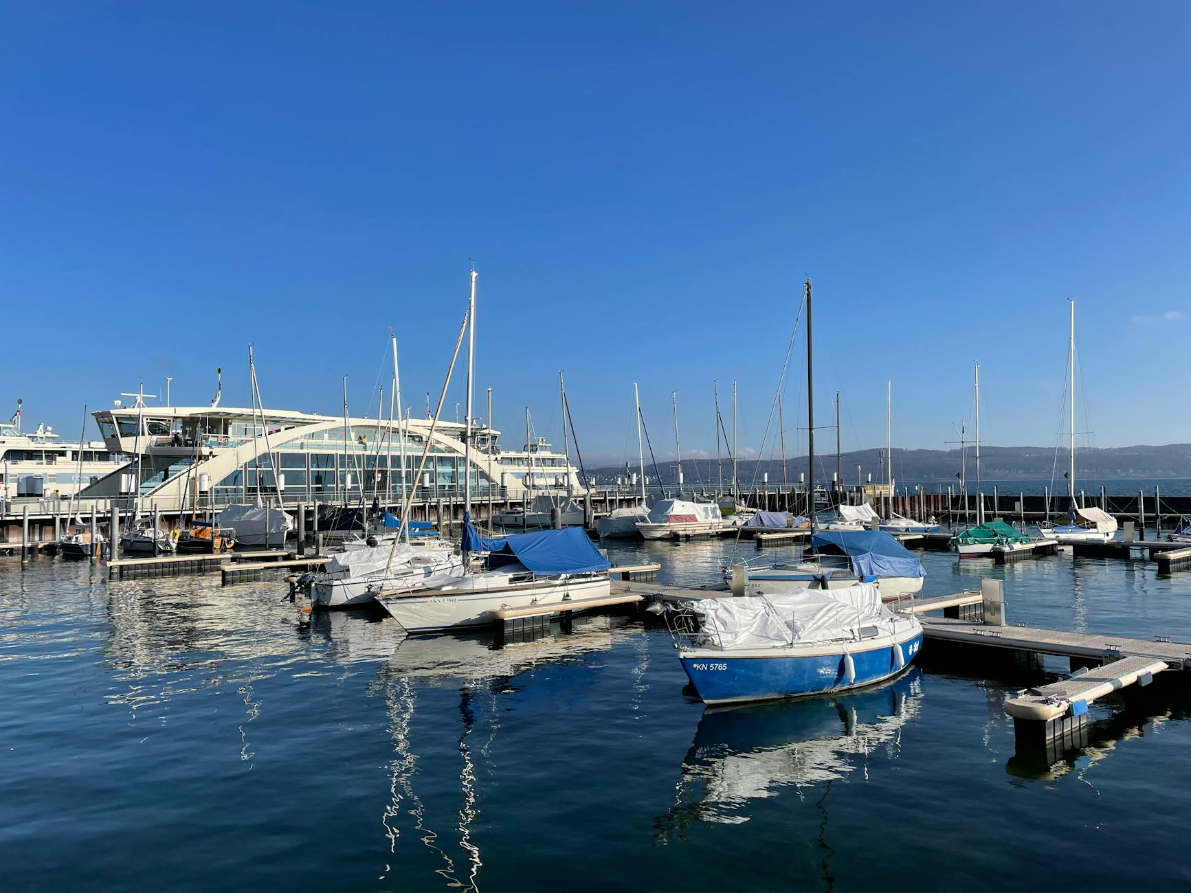 Sailing boats in a Swiss marina context for shore-time planning.