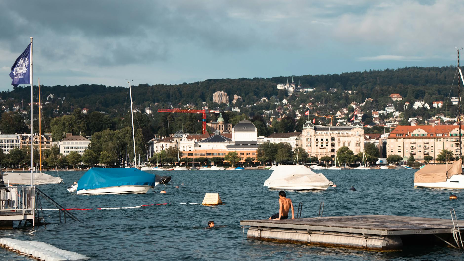 People relaxing by Lake Zurich context for family meal breaks.