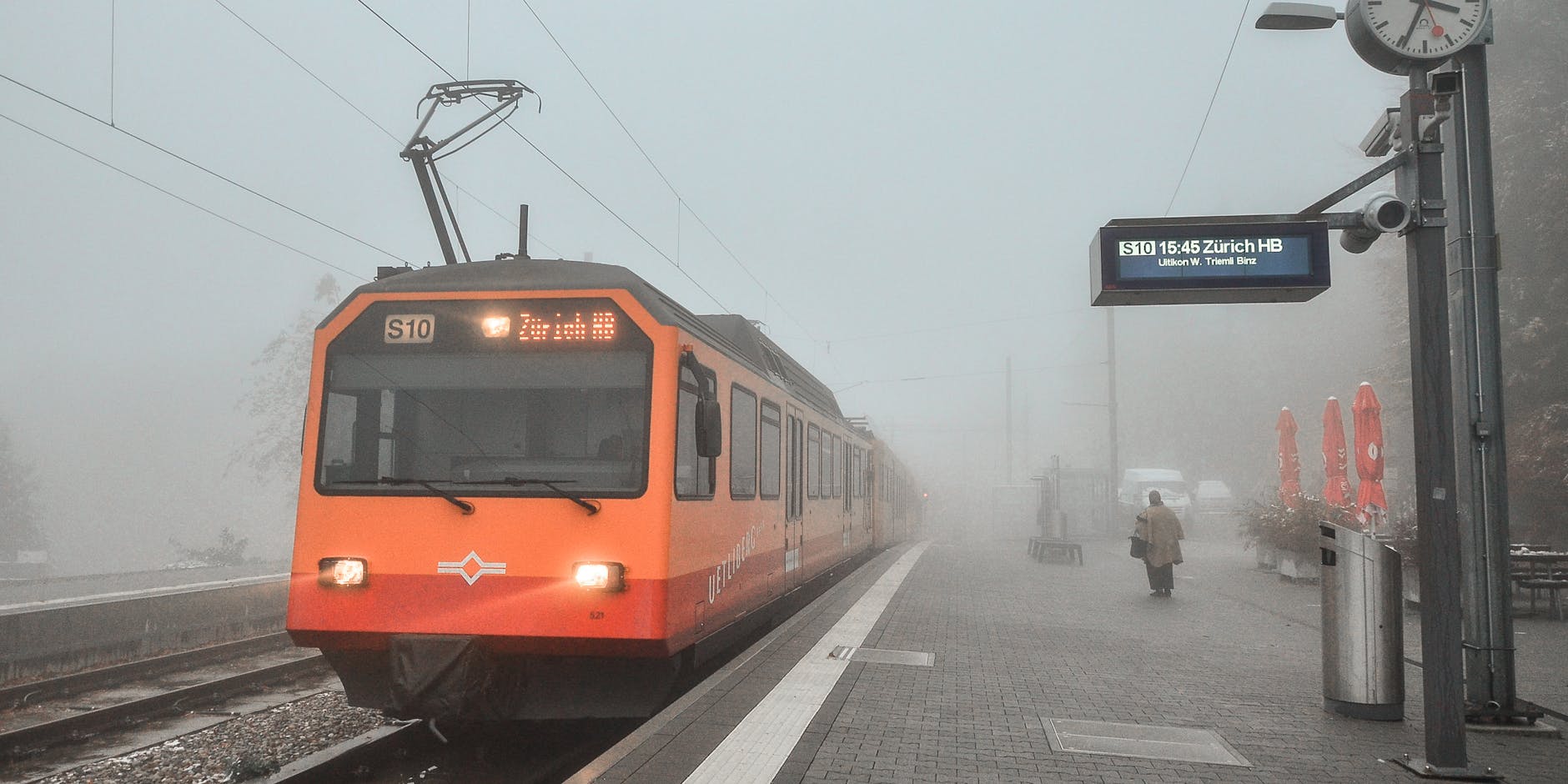Foggy Zurich train arrival context for fatigue and timing control.