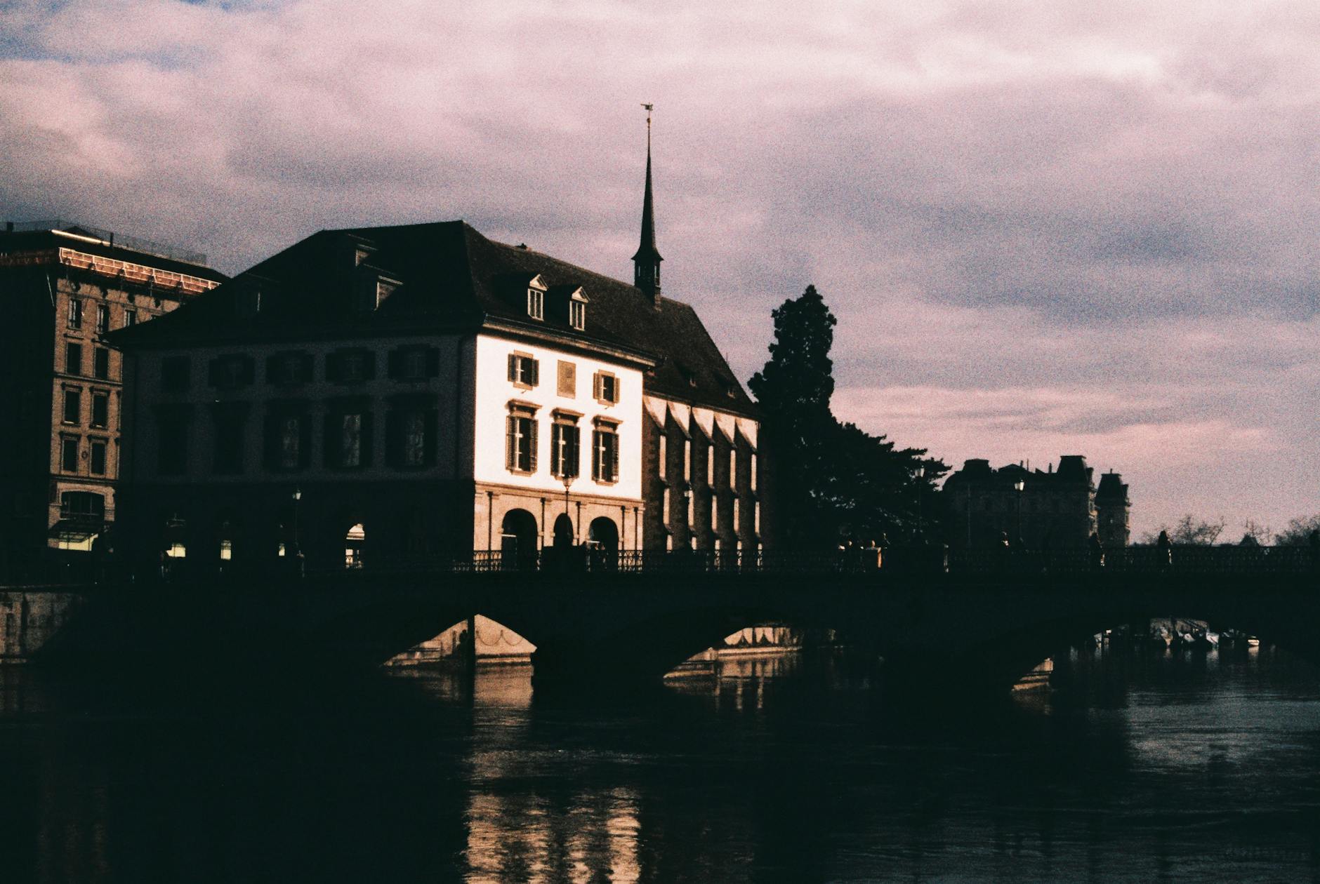 Zurich bridge at sunset context for journalism budgeting and routing.