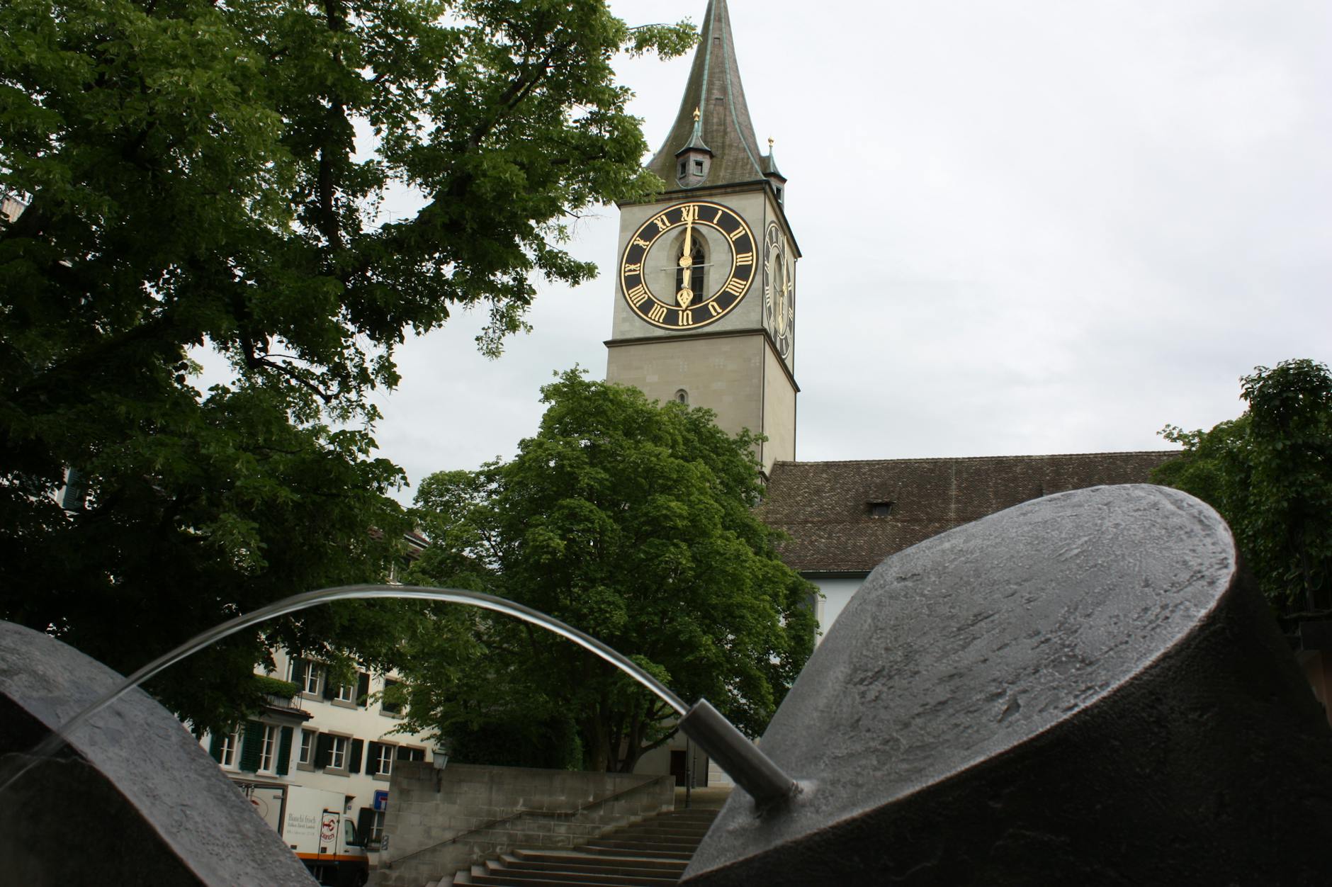 St. Peter Church clock tower and fountain context for Zurich pilgrimage report planning.