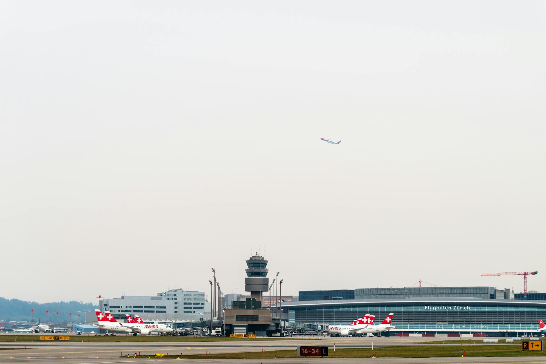 Zurich Airport aircraft and control tower context for entry and airport procedures.
