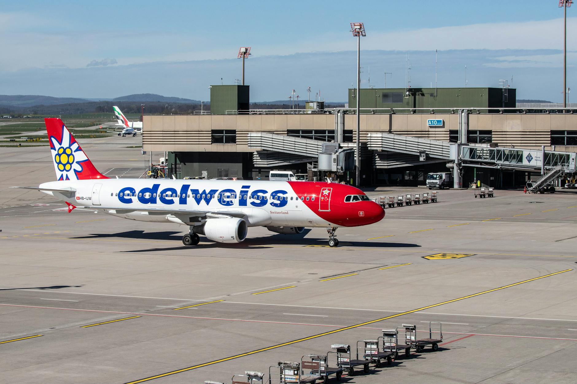 Aircraft at Zurich Airport terminal context for baggage and stopover planning.