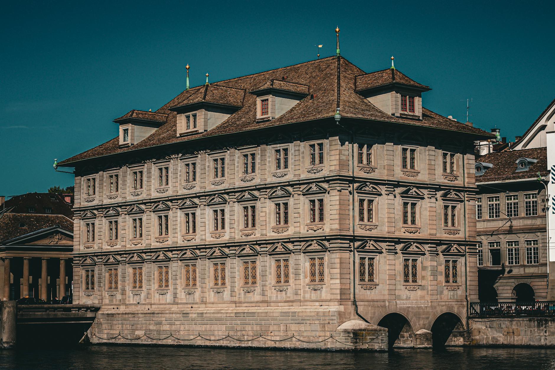 Zurich town hall by the river context for NGO travel report planning.