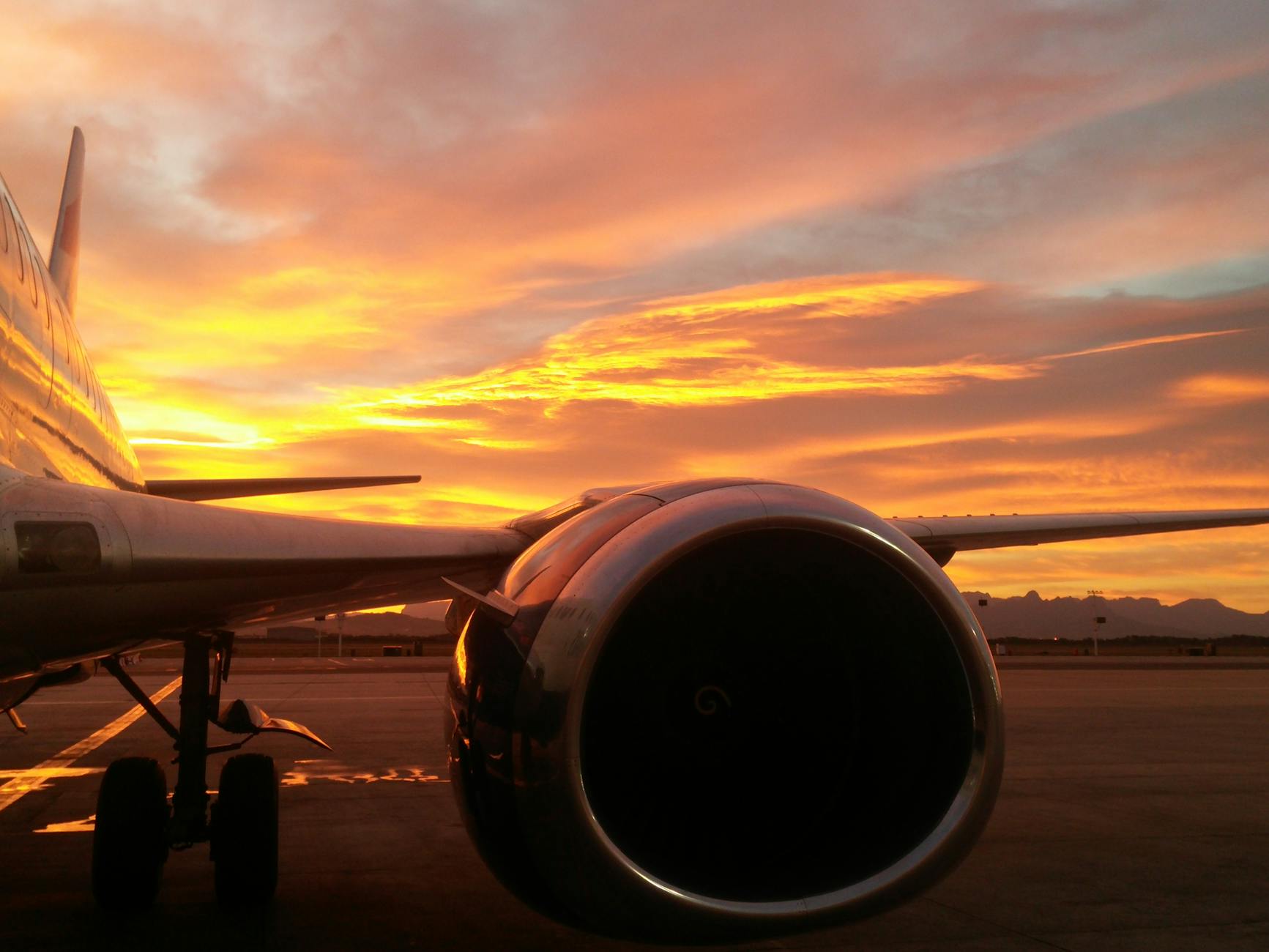 Aircraft turbine at Cape Town airport during sunset.