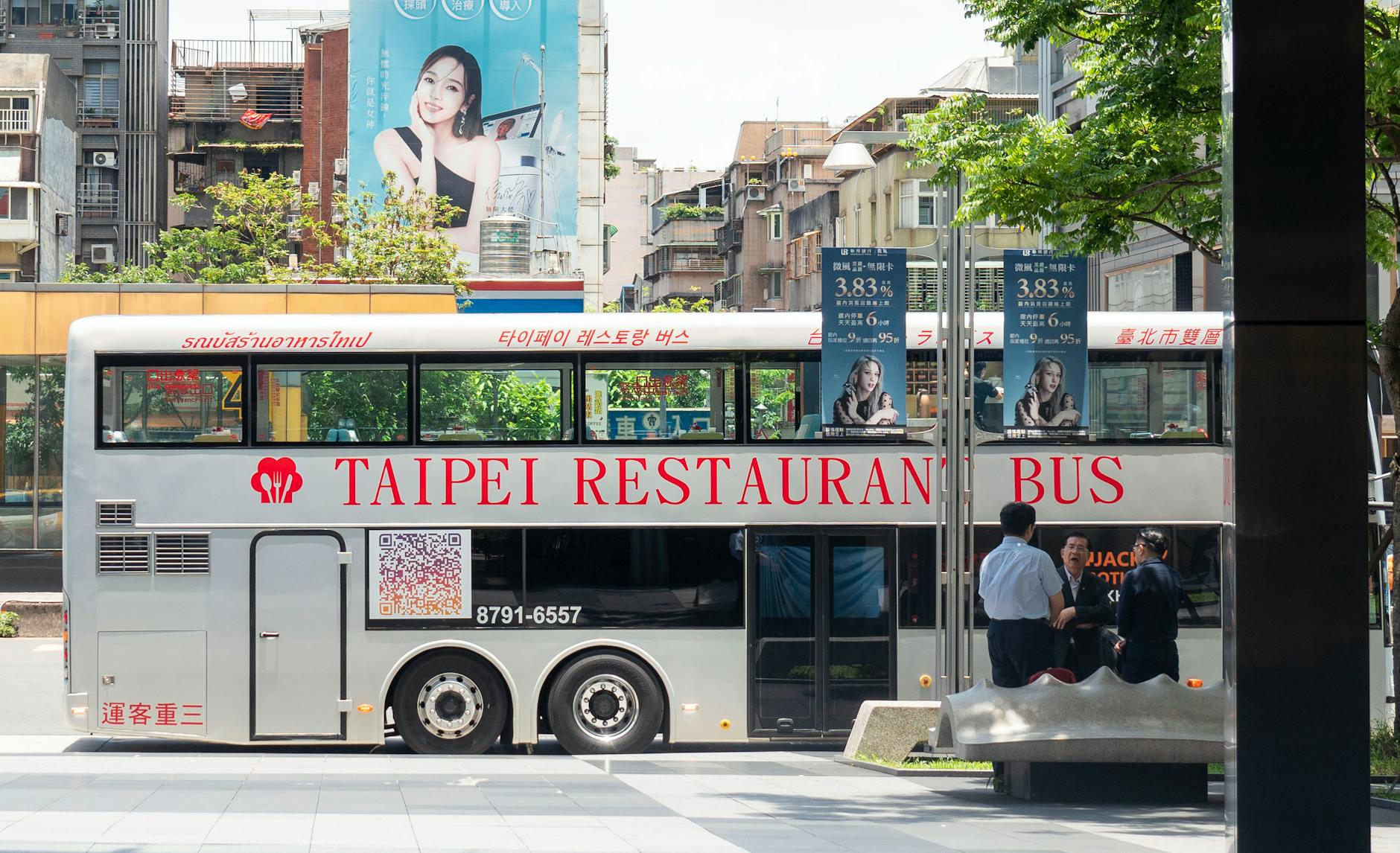 Taipei city bus on an urban street.