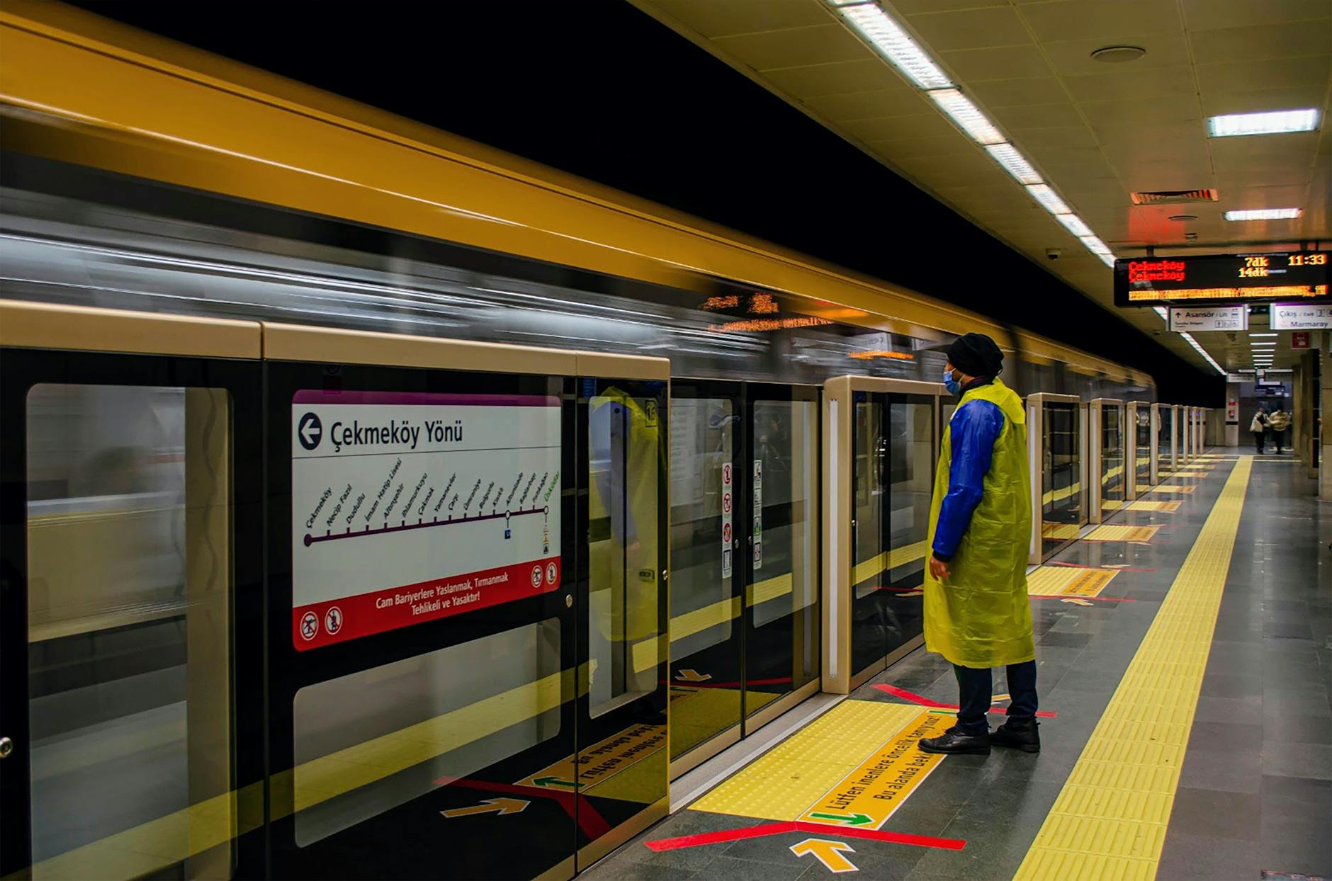 Istanbul metro platform with train doors open.